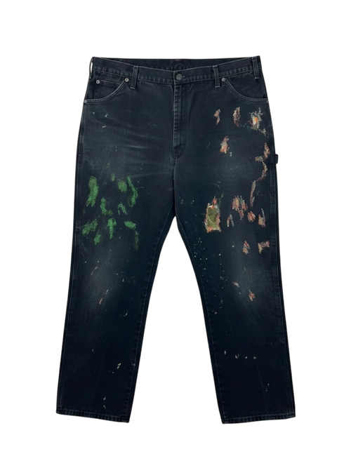 Lahad Vintage black distressed carpenter pants with paint splatters and multiple tool pockets.