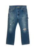 Lahad Vintage blue denim carpenter jeans with hand-stitched details, paint splatters, and distressed rips.