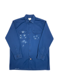 Lahad Vintage dark blue long-sleeve work shirt with embroidered white flowers and 'charlie' script on hem.
