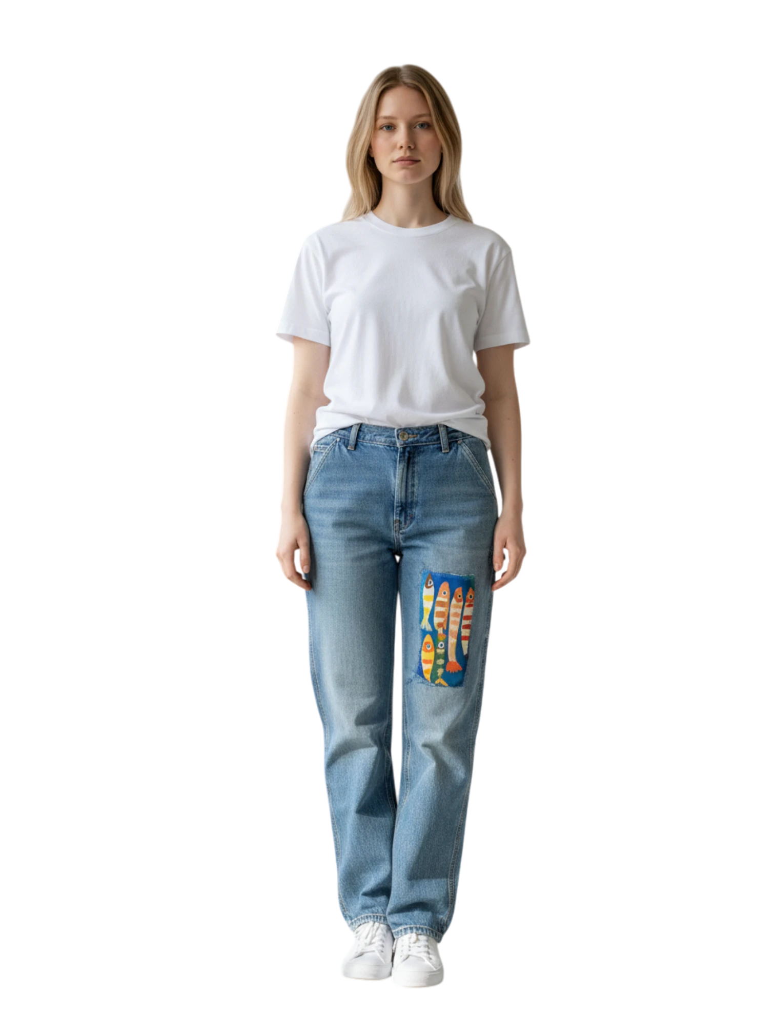 Lahad Vintage light wash denim jeans with a custom fish patch on the left leg. Model wears a white t-shirt and white sneakers.