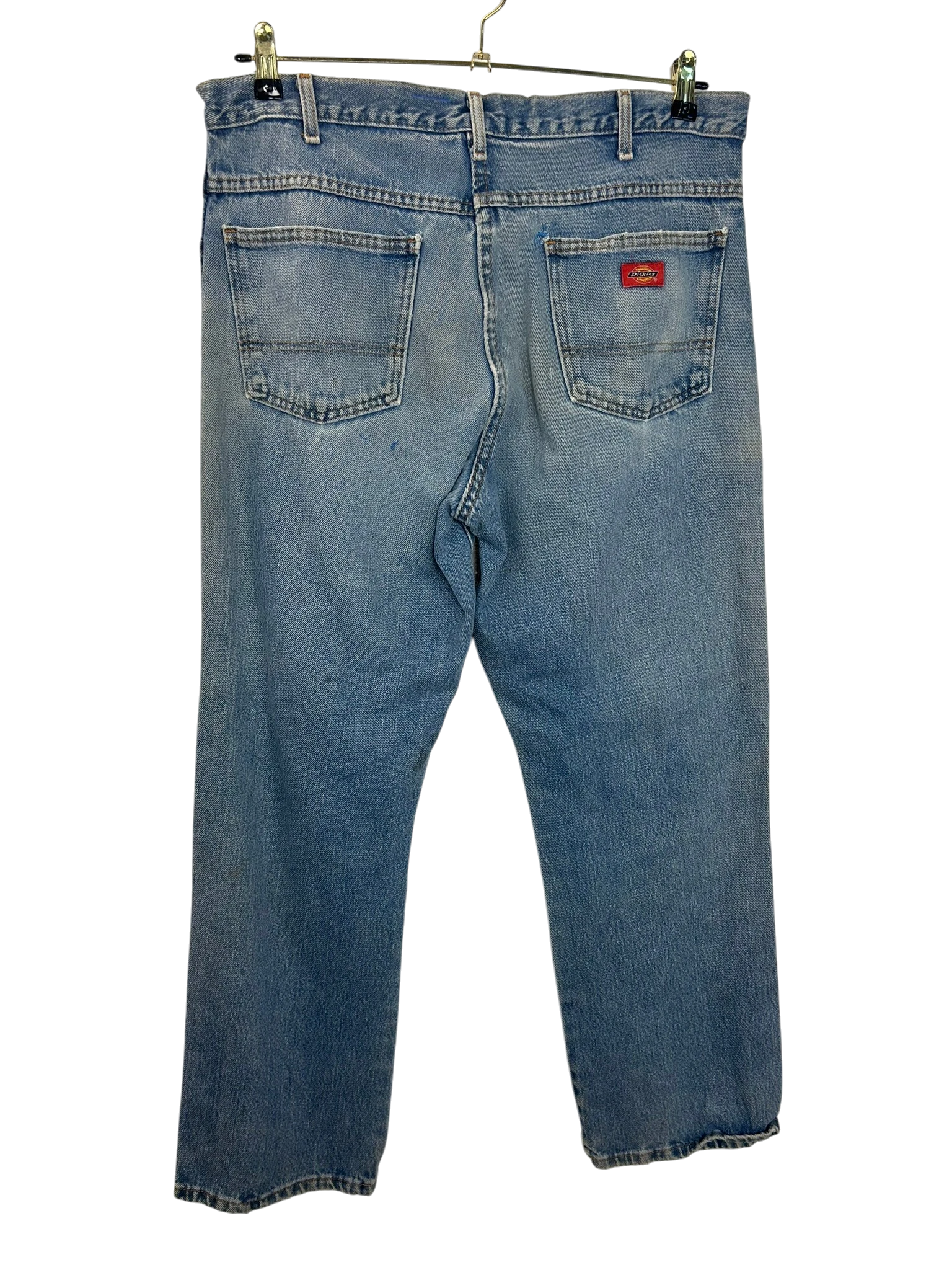Lahad Vintage light wash denim jeans with red Dickies logo patch on back pocket. Classic five-pocket style.
