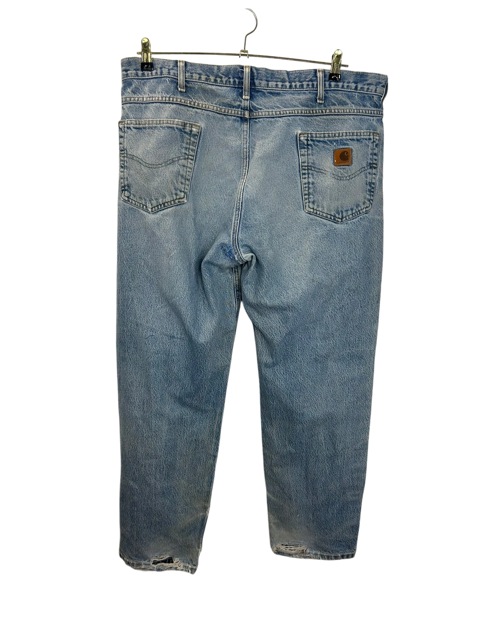 Lahad Vintage light wash distressed denim jeans with relaxed fit and frayed hems. Features a brown leather patch on the back pocket.