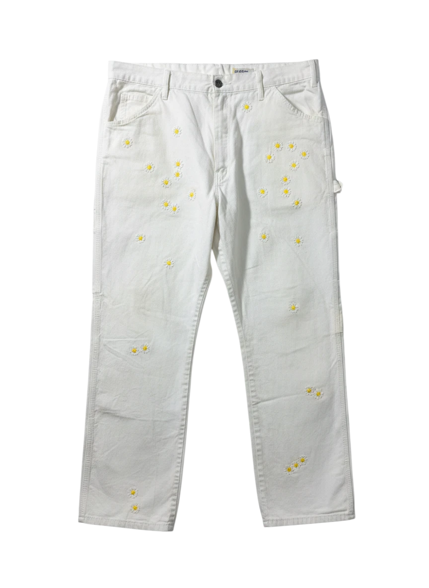 Lahad Vintage white canvas carpenter pants with embroidered daisy flowers throughout. Relaxed fit, utility style.