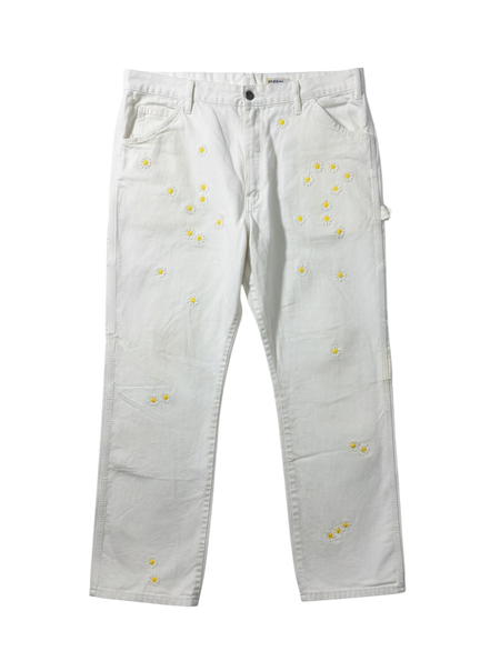 Lahad Vintage white canvas carpenter pants with embroidered daisy flowers throughout. Relaxed fit, utility style.