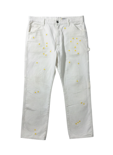 Lahad Vintage white canvas carpenter pants with embroidered daisy flowers throughout. Relaxed fit, utility style.